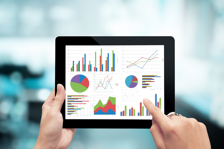 Closeup hand holding digital tablet show analyzing graph